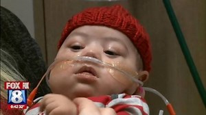 12K views · 305 reactions | Even our babies are wearing red today. Zyaire Reed is the first in our NICU to get a hand-knitted red hat compliments of volunteers for the American Heart Association Akron’s Little Hats, Big Hearts program. He’ll have surgery soon to fix 2 congenital heart defects. Thanks for sharing Fox 8 News. #GoRed | Akron Children's | Facebook