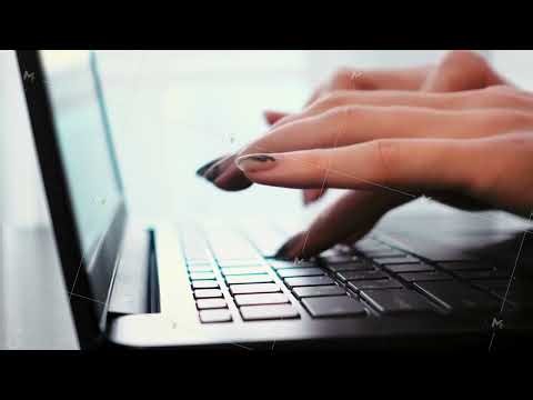 Closeup of female hands typing on laptop keyboard