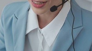 Download Young customer service representative wearing headset in office for free