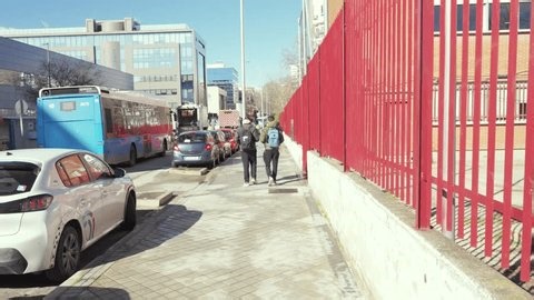 clip-4007765043-madrid-spain02-19-2026-red-fence-separates-sidewalk-street