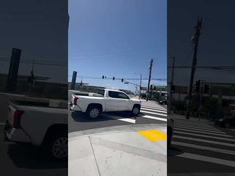 LAX Transit Center and traffic signal on Aviation Blvd at Arbor Vitae St .