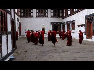 Dancing buddhist monks in Trongsa Dzong, Bhutan