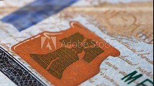 100 dollar bill very close-up, fast motion camera frame of paper bill details, President United States of America Benjamin Franklin, fast-paced frame. Financial success and abundance.