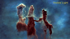 宇宙にそり立つ｢創造の柱｣の3D映像。まるで星雲の中を飛ぶよう