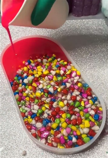 Mixing Neon Pink and Rainbow Pebbles in Resin Art