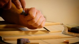Luthier making a flamenco guitar, close up