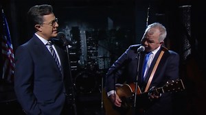 4.4M views · 153K reactions | Please enjoy this special duet Stephen Colbert calls “one of the happiest moments I’ve had on my show.” Filmed at the Ed Sullivan Theater in 2016 but never aired on The Late Show, this performance features John Prine on guitar, sharing vocals with a very grateful Stephen Colbert on a song called “That’s the Way the World goes Round.” | The Late Show with Stephen Colbert | Facebook