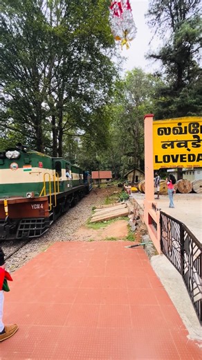 Voyaging Spirit ❤️ on Instagram: "Lovedale Railway Station 🌄🚂 Nestled in the Nilgiri Hills of Tamil Nadu, Lovedale Railway Station is a charming stop on the UNESCO-listed Nilgiri Mountain Railway route between Ooty and Coonoor. Surrounded by misty hills, pine trees, and cool mountain air, this small station feels calm, scenic, and timeless. It’s known for: • Vintage blue mountain train vibes 🚞 • Lush greenery and peaceful surroundings 🌿 • Old-world colonial charm • Perfect photo & video spot