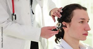 Doctor uses otoscope to detect diseases of hearing organs