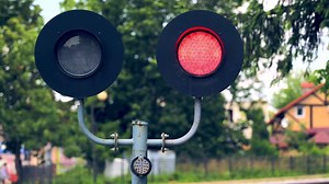 Traffic light flashing red lights. Railway traffic light that prohibits the movement of cars. Traffic light on the railway.