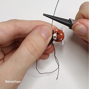 Just my red panda pattern Embroidery threads a hook 0.5 mm. 😁 Pattern is here: https://www.ravelry.com/patterns/library/red-panda-spunky | Amigurumi Artist NansyOops