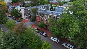 Historic row houses in downtown American city. Aerial push in shot of city housing in Northeast USA.