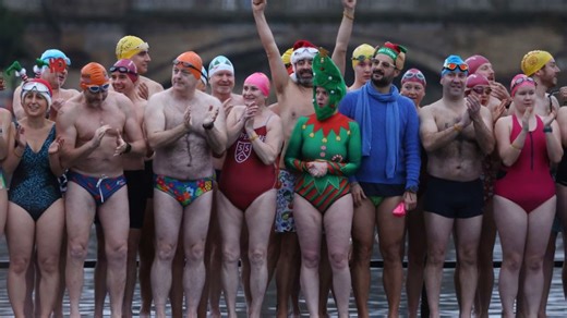 Where do swimmers take an icy dip in one of world's oldest swimming races?