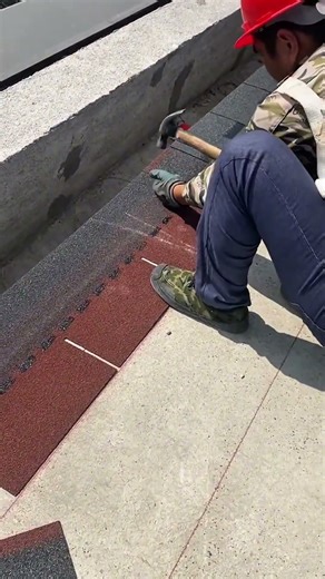 Nailing roof tile stickers carefully to secure placement and ensure durability against wind and rain