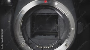 Close up of working camera shutter. Camera shutter blades opening and closing in slow motion