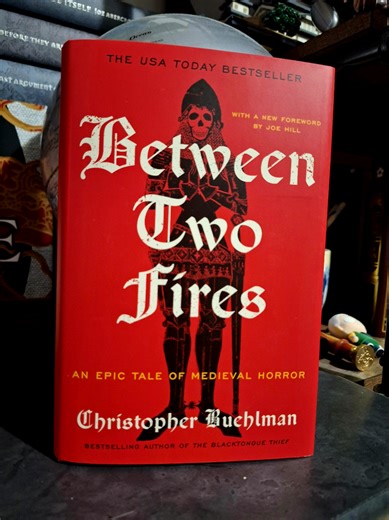Between Two Fires by Christopher Buehlman has a new deluxe hardcover edition with black sprayed edges, designed endpapers and a new forward from Joe Hill. It's an elite blend of historical fiction, fantasy and horror and you can get it today! #betweentwofires #christopherbuehlman #nightfirebooks #bookstagram #fantasybooks