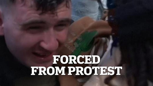 Jake Lang pelted with objects then forced to leave protest