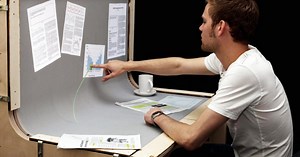The computer, monitor and desk merge in BendDesk