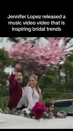 In Jennifer Lopez's new music video teaser, she is seen wearing a stunning bow wedding veil. The veil adds a touch of playful fun to her overall look. It seems that this visual has inspired an increasing number of requests for bow veils in weddings. Brides are drawn to the unique and fashionable style of the bow veil, wanting to replicate the same sophisticated and eye-catching appeal. This trend showcases how celebrities can influence and shape wedding fashion, making it a desirable choice for