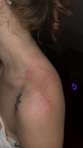 White Lightning Bolt Tattoo on Back | Lightning Tattoo Ideas