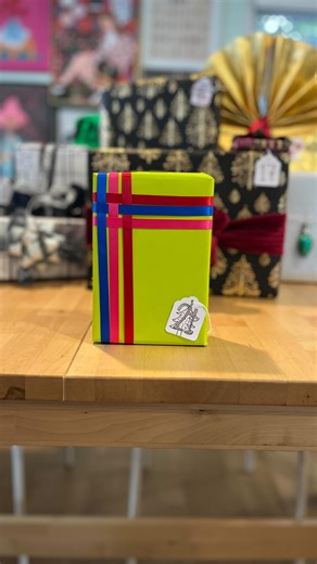 Kristin Jane Smith on Instagram: "Day 21: Weave Ribbon Technique Simple yet satisfying, this satin ribbon technique gives you a modern and sleek edge to any gift. The more colors the better!! #giftwrappingchallenge #25daysofchristmas #giftwrappingideas #satinribbon #21 Shoutout to @sjsbujo for *not* thinking about 21 when drawing 21…"