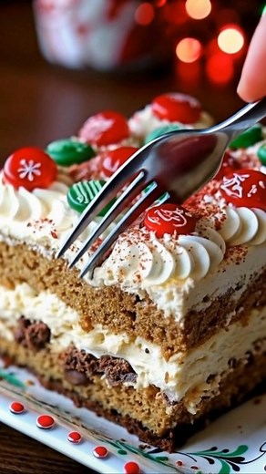 Gingerbread Christmas Cake with Whipped Frosting | Festive, Fluffy & Full of Holiday Spirit 🎄🍰 This cake is everything I love about the holidays — warm spices, creamy layers, and a pop of color from those jolly red and green candies! It’s the kind of dessert that makes the whole table smile ❤️ Ingredients: For the gingerbread cake: 2 ½ cups all-purpose flour 1 tsp baking soda 1 tsp cinnamon 1 tsp ground ginger ½ tsp cloves ¼ tsp nutmeg ½ tsp salt ½ cup brown sugar ½ cup molasses 2 eggs 1 cup b