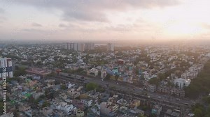 An immersive aerial footage revealing the vibrant life of Chennai, featuring residential neighborhoods, busy streets, and dynamic traffic patterns.