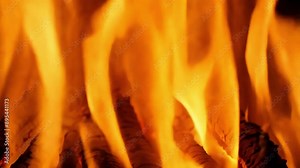 Waves of orange yellow and red flames merge and separate creating an everchanging panorama of flame patterns.