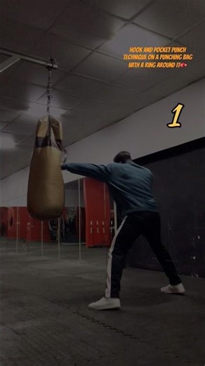 Hook and pocket punch technique on a punching bag with a ring around it🥊 #boxing #mma #ufc