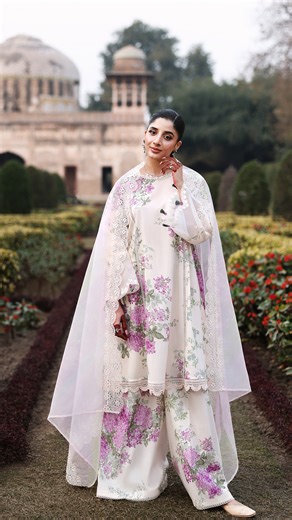 Cross Stitch on Instagram: "Candy Floss A classic printed shirt kissed with florals comes adorned with embroidered patti detailing that softly frame the sleeves. Paired with a coordinating printed trouser adding refinement, the sheer organza dupatta, delicately printed and embroidered completes the look with effortless femininity. Unstitched Eid Lawn – Pre-book Tomorrow at 3:00 PM PKT #crossstitchpk #eidlawn #eid #crossstitch #cselflove #spring #eid #crossstitchgirls"
