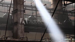 Tires on the conveyor in the tire pressing shop. Mechanical engineering and heavy industry. Interior tire factory with overhead conveyors. Manufacture of tires. Tyre production machine conveyor.