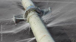 Seamlessly looping water leaking from hole in a industrial hose.