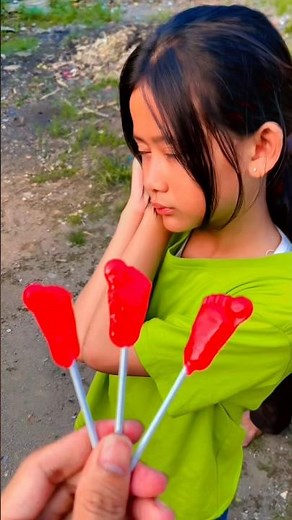 Eating foot-shaped candy