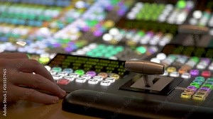 Close-up of hand operating Broadcast Tv Studio Production - Vision Switcher, Control Room
