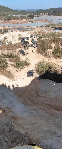 Off-Road Vehicle Climbing a Sandy Incline