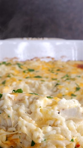 Angel Chicken and Rice Casserole Recipe – comfort food at its best! Chicken, rice, cream cheese, butter, garlic, cream of chicken soup, Italian dressing mix, chicken stock, and cheese. Creamy, comforting, and absolutely delicious! This casserole is an easy dinner idea the whole family will love. Perfect with a side salad or roasted veggies! Full Recipe: https://buff.ly/p3ZfJ4T | Plain Chicken