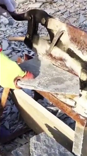 cutting natural grey slate stone tiles using a manual heavy duty lever action stone splitter tool