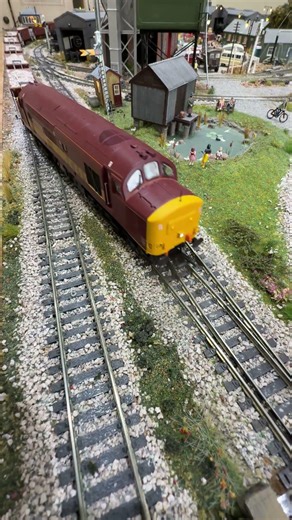 Class 37 37418 passes over a Peco streamlined points crossover.