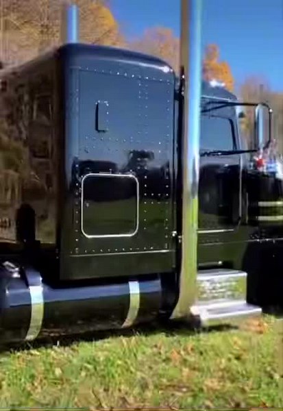 Showcasing a Stunning Black Semi-Truck with Chrome Accents