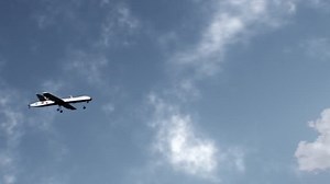 3D animation of military drone flight. Combat drone on military mission. Cloudy sky on background. Remotely-piloted aircraft. Concept of using modern UAV technology for military battles or in war.