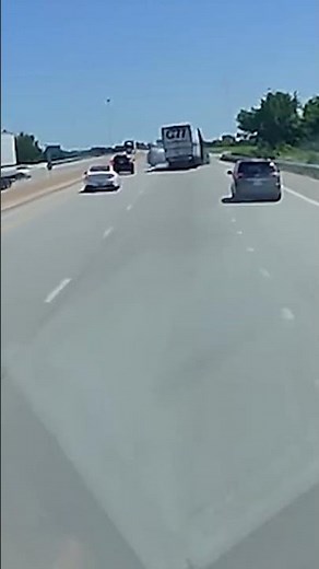 Semi-truck driver survives crash off overpass and explosion; driver of car flees scene