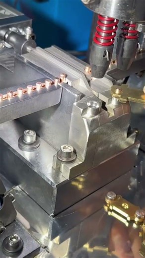 The process of installing a piercing on pressed aluminum copper using a sophisticated machine.#fyp