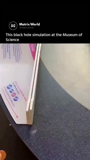 Matrix World on Instagram: "This is a black hole simulation — a hands-on exhibit that turns complex gravity into something you can actually see 🌀. As coins roll across the curved surface, they spiral inward just like matter falling toward a real black hole. It’s a simple way to understand how massive objects bend spacetime and trap everything that comes too close. Follow @matrix.world Dm for credit/removal #BlackHole #SpaceScience #PhysicsExplained #UniverseMysteries #ScienceExhibit 🌌"