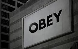 "Obey / Stay Asleep" Sign Spotted on I-90