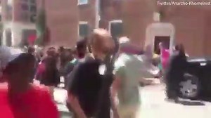 Car smashes into crowd of counter-protesters