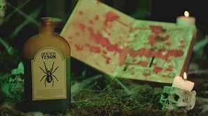 Filling a skull-shaped glass with spider venom - Free Stock Video