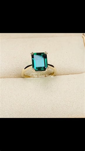 This stunning Green emerald solitaire engagement ring in a cathedral design, cast from yellow gold 💚💍 Inbox us for details 💍 . . . #greenemerald #greenemeralds #greenemeraldring | The Luxe Store