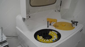 Hospital laboratories, automatic biochemical analyzer. Auto sampler, scientific Instrument, science Laboratory. Round automated device for medical tests in a modern hospital. Robotic tool in medicine