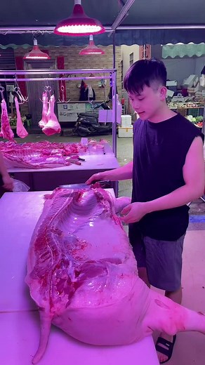 Meat Preparation in a Bustling Market Scene