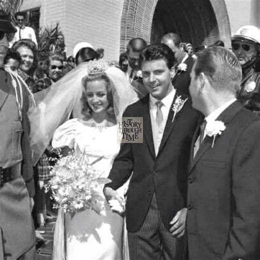 "‘Rio Bravo’ actor and rock ’n’ roll star Ricky Nelson weds his longtime love, Kristen Harmon, in a classic Los Angeles ceremony at the St. Martin of Tours Catholic Church in Brentwood, April 20, 1963. Surrounded by family, including Kristen’s father, football legend Tom Harmon, and her brother, actor Mark Harmon, the wedding brought together two prominent American entertainment families. Ricky, the son of Ozzie and Harriet Nelson, had already charmed the nation on television and in music, while